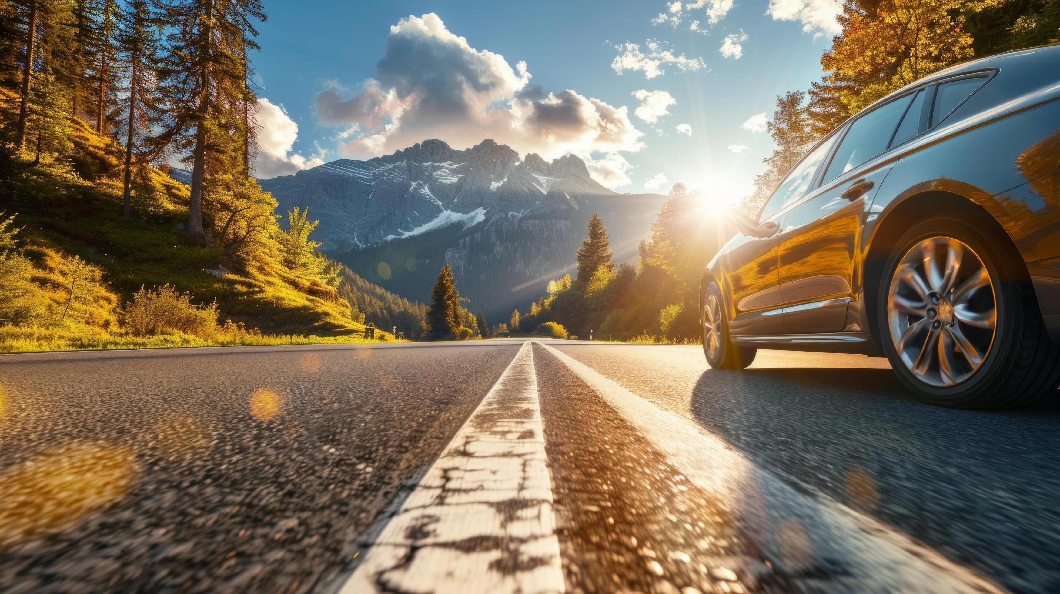 A car driving along a highway during a scenic road trip